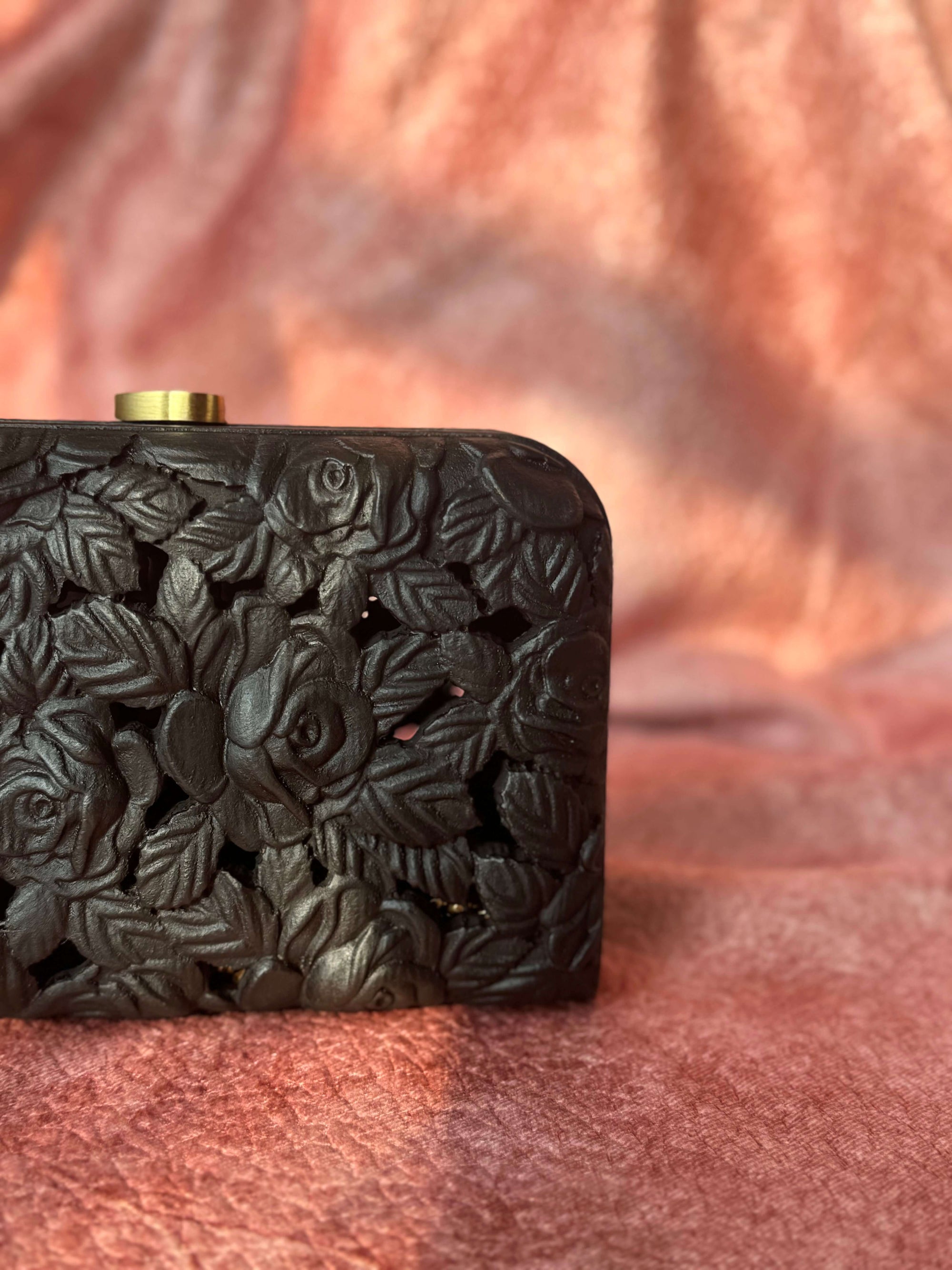 Carved wood clutch with delicate roses and leaves in black finish