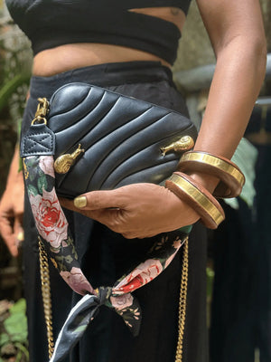 vegan leather puffed box clutch bag with brass snails