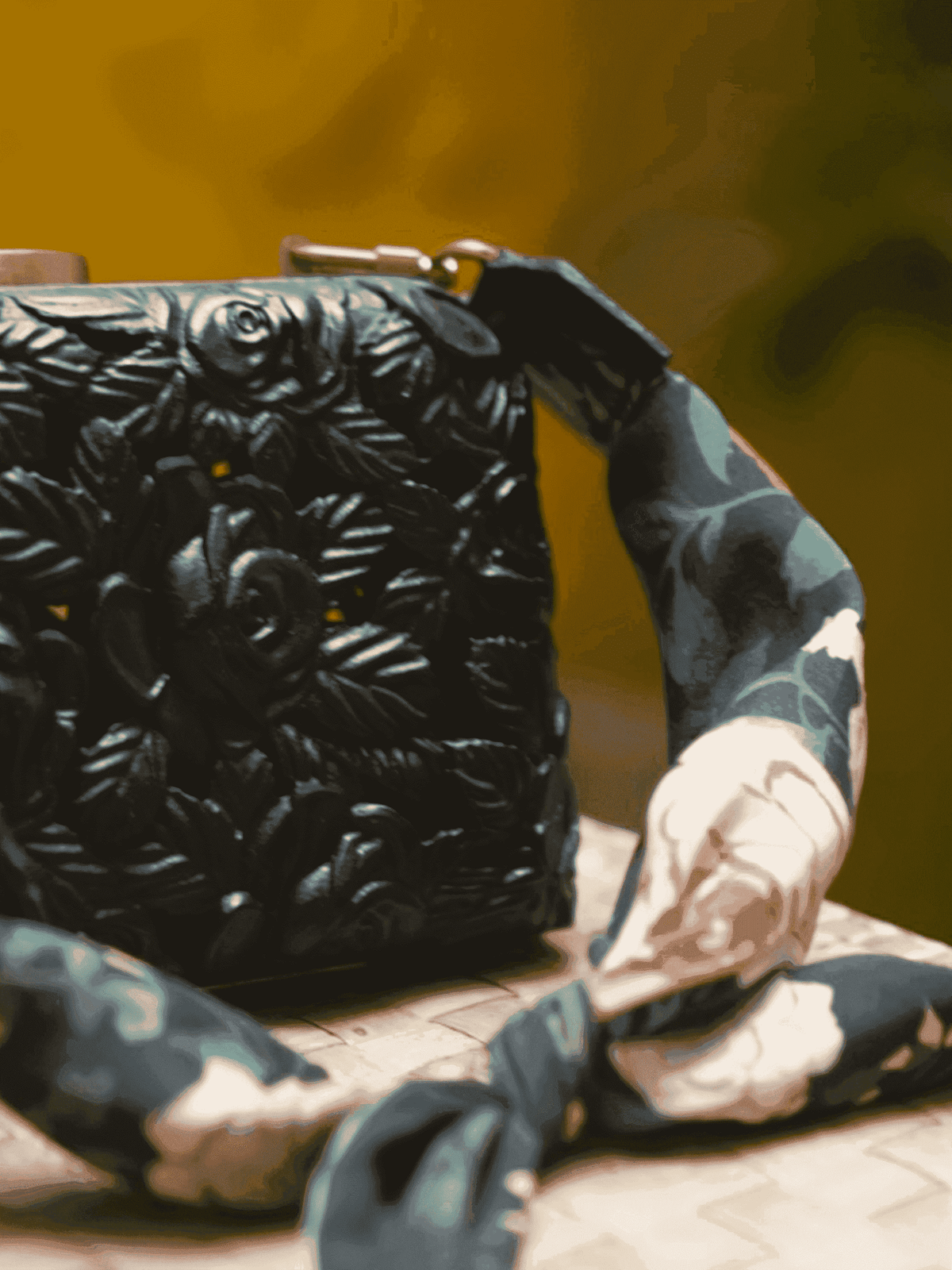 Carved wood clutch with delicate roses and leaves in black finish