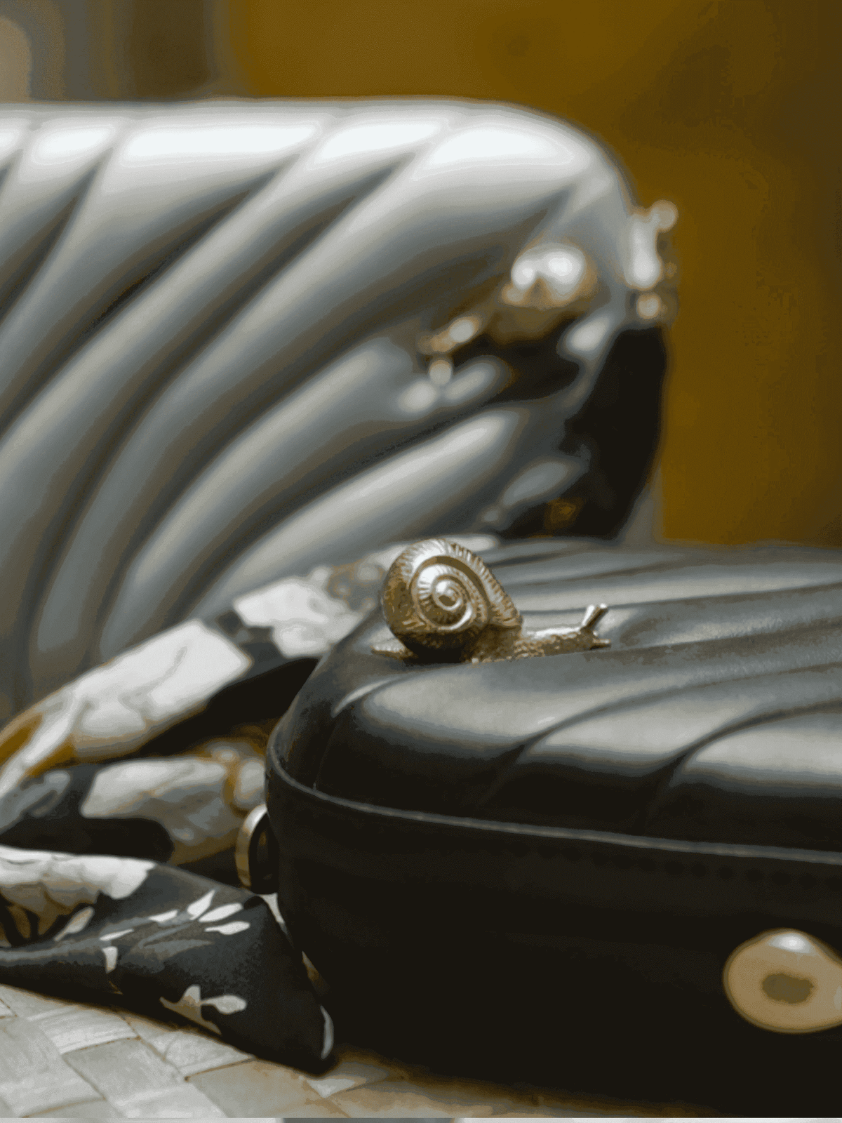 vegan leather puffed box clutch bag with brass snails